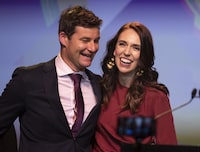 FILE - New Zealand Prime Minister Jacinda Ardern, right, is congratulated by her partner Clarke Gayford following her victory speech to Labour Party members at an event in Auckland, New Zealand, Oct. 17, 2020. After almost five years of engagement and a postponement due to the coronavirus pandemic, former New Zealand Prime Minister Jacinda Ardern has married longtime partner Clarke Gayford in a private ceremony in New Zealand, Saturday, Jan. 13, 2024. (AP Photo/Mark Baker, File)