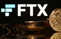 Representations of cryptocurrencies are seen in front of displayed FTX logo in this illustration taken November 10, 2022. REUTERS/Dado Ruvic/Illustration