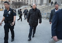 Wayne LaPierre, center, CEO of the National Rifle Association, leaves the courthouse as a jury continues deliberations during a trial at New York State Supreme Court in Manhattan, Tuesday, Feb. 20, 2024. (AP Photo/Craig Ruttle)