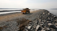 A dump truck drives at the construction site of a new dam on the Angara river for an enlargement of an open-pit mine of the Gorevsky GOK lead and zinc ore mining and processing plant near the Siberian settlement of Novoangarsk, Russia, August 16, 2016.