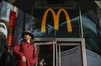A person passes a McDonald's restaurant in Times Square on Nov. 4, 2019 in New York City.