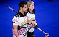 Kadriana and Colton Lott discuss strategy at the Canadian Mixed Doubles Curling Championship in Calgary, Wednesday, March 24, 2021. The Lotts scored an 11-4 win over Australia on Thursday to qualify for the playoffs at the world mixed doubles curling championship.THE CANADIAN PRESS/Jeff McIntosh
