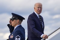 President Joe Biden pauses to respond to a question from a member of the traveling press as he boards Air Force One at Andrews Air Force Base, Md., Friday, April 12, 2024, enroute to New Castle, Del. (AP Photo/Pablo Martinez Monsivais)