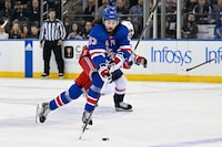 Apr 23, 2024; New York, New York, USA;  New York Rangers center Mika Zibanejad (93) skates across the blue line against the Washington Capitals during the first period in game two of the first round of the 2024 Stanley Cup Playoffs at Madison Square Garden. Mandatory Credit: Dennis Schneidler-USA TODAY Sports