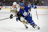 Mar 4, 2024; Toronto, Ontario, CAN; Toronto Maple Leafs forward William Nylander (88) and Boston Bruins defenseman Charlie McAvoy (73) battle for position during the first period at Scotiabank Arena. Mandatory Credit: John E. Sokolowski-USA TODAY Sports