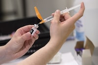 The Pfizer-BioNTech COVID-19 vaccine is prepared at a vaccination clinic in Dartmouth, N.S., on Thursday, June 3, 2021. Anyone over the age of 70 in Nova Scotia can now book a second booster dose of the COVID-19 vaccine. THE CANADIAN PRESS/Andrew Vaughan