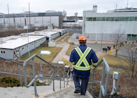 Workers return to the plant after a news conference at the Pickering Nuclear Generating Station in Pickering, Ont., Tuesday, Jan. 30, 2024. THE CANADIAN PRESS/Frank Gunn