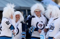 Carrie and Joshua Kulbisky at a Winnipeg Jets Whiteout Party in Winnipeg, April 21, 2024. Shannon VanRaes/The Globe and Mail
