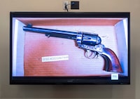 The revolver that actor Alec Baldwin was holding and fired, killing cinematographer Halyna Hutchins and wounding the film’s director Joel Souza, is displayed during the trial against Hannah Gutierrez-Reed, in Santa Fe, N.M., Thursday, Feb. 22, 2024. (Eddie Moore/Santa Fe New Mexican via AP, Pool)