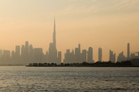Haze obscures the Dubai skyline including Burj Khalifa, the world's tallest building on December 4, 2023. The United Arab Emirates is choking under "alarmingly high" air pollution levels fed by its fossil fuel industry, Human Rights Watch warned on December 4, as the oil-rich country hosts the UN's COP28 climate talks in Dubai. (Photo by Giuseppe CACACE / AFP) (Photo by GIUSEPPE CACACE/AFP via Getty Images)