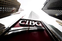 A CIBC sign is shown in the financial district in Toronto on Tuesday, August 22, 2017. THE CANADIAN PRESS/Nathan Denette