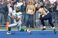 Saskatchewan Roughriders D.J. Flick (3) gets set to catch the TD pass against the Winnipeg Blue Bombers Kelly Malveaux (27 in second half CFL action in Winnipeg, Sunday, September 9, 2007. (CP PHOTO/John Woods) CANADA