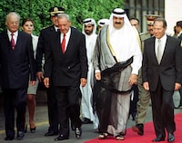 From R to L, Lebanese President Emile Lahoud, Qatari Emir Hamad bin Khalifa al-Thani, Lebanese Prime Minister Salim Hoss, and Lebanese speaker of parliament Nabih Berri walk before the honor guard at the Baabda presidential palace near Beirut 15 August 2000. Sheikh Hamad is on the second leg of a tour of Syria, Lebanon and Egypt for talks on the economy and the peace process between Israel and the Palestinians. (Photo by Ousama AYOUB / AFP) (Photo by OUSAMA AYOUB/AFP via Getty Images)