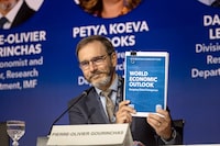Director of the IMF Research Department Pierre-Olivier Gourinchas lifts a copy of the World Economic Outlook (WEO) report during at a press briefing on the second day of the annual meetings of the International Monetary Fund (IMF) and the World Bank Group (WBG) in Marrakesh on October 10, 2023. The IMF on October 10 left its top-line global growth forecast for 2023 unchanged, despite significant underlying differences between regions, while lifting its inflation outlook for the next couple of years. (Photo by FADEL SENNA / AFP) (Photo by FADEL SENNA/AFP via Getty Images)