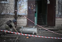 A bomb squad member works next to a part of a missile after a Russian missile attack, amid Russia's attack on Ukraine, in Kyiv, Ukraine March 21, 2024. REUTERS/Viacheslav Ratynskyi