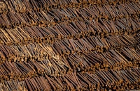 Logs are seen in an aerial view stacked at a sawmill in Grand Forks, B.C., Saturday May 12, 2018. Western Forest Products Inc. says it will temporarily reduce its lumber production levels for the rest of the year. THE CANADIAN PRESS/Darryl Dyck
