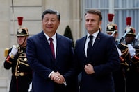 French President Emmanuel Macron shakes hands with China's President Xi Jinping as he arrives for a meeting at the Elysee Palace in Paris as part of the Chinese president's two-day state visit in France, May 6, 2024. REUTERS/Gonzalo Fuentes