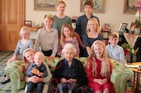 A family portrait of Britain's late Queen Elizabeth II with some of her grandchildren and great grandchildren (back row, left to right) Lady Louise Mountbatten-Windsor, James, Earl of Wessex, (middle row, left to right) Lena Tindall, Prince George, Princess Charlotte, Isla Phillips, Prince Louis, (front row, left to right) Mia Tindall holding Lucas Tindall, and Savannah Phillips, taken at Balmoral Castle, Britain, in this undated handout image issued by Kensington Palace on April 21, 2023, with indications by Reuters of areas which appear to have been digitally altered by the source. The Prince and Princess of Wales/Kensington Palace/Handout via REUTERS