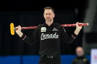 Canada skip Brad Gushue reacts to his last shot in the third end during action against Scotland in the finals at the Men's World Curling Championship, in Ottawa, Sunday, April 9, 2023. THE CANADIAN PRESS/Adrian Wyld