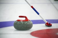 An image of the curling stone and broom on the ice. Team sports. Winter sports. . sports. Ice sports. See more curling photos in my portfolio. Curling game
