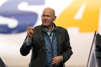 FILE PHOTO: Dave Calhoun, CEO of Boeing, speaks on stage during the delivery of the final 747 jet at their plant in Everett, Washington, U.S. January 31, 2023.  REUTERS/David Ryder/File Photo