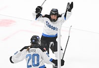 Toronto's Sarah Nurse (20) celebrates with teammate Emma Maltais (27) after scoring against  Montreal during overtime period PWHL hockey action at the Bell Centre in Montreal, Saturday, April 20, 2024. THE CANADIAN PRESS/Graham Hughes