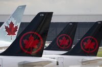 A new report says Air Canada ranked last in on-time performance among the 10 largest North American airlines. Air Canada logos are seen on the tails of planes at the airport in Montreal, Que., Monday, June 26, 2023. THE CANADIAN PRESS/Adrian Wyld