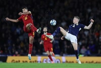 Soccer Football - UEFA Euro 2024 Qualifiers - Group A - Scotland v Spain - Hampden Park, Glasgow, Scotland, Britain - March 28, 2023 Spain's Rodri in action with Scotland's Scott McTominay REUTERS/Russell Cheyne