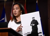 MP Mumilaaq Qaqqaq holds a photo of Johannes Rivoire during a news conference on Parliament Hill in Ottawa, on Thursday, July 8, 2021. The Oblates of Mary Immaculate says Rivoire, a priest accused of sexually abusing Inuit children in Nunavut, has died after a long illness.THE CANADIAN PRESS/Justin Tang