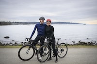Veronica Ochoa and Jamie Watson cycle along Vancouver’s seawall on February 19, 2024. 
(Jennifer Gauthier/The Globe and Mail)


