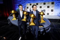 SangYup Lee, Executive Vice President and Head of Hyundai and Genesis Global Design Center, poses with the 2023 World Car Person of the Year award, and Jose Munoz, Global President and COO of Hyundai Motor Company and the president and CEO of Hyundai and Genesis Motor North America, poses with the the 2023 World Car of the Year award for Hyundai IONIQ 6, during the 2023 World Car Awards at the New York International Auto Show, in Manhattan, New York City, U.S., April 5, 2023. REUTERS/Andrew Kelly