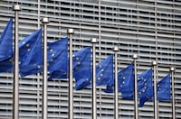 FILE PHOTO: European Union flags flutter outside the EU Commission headquarters in Brussels, Belgium, in this file picture taken October 28, 2015. REUTERS/Francois Lenoir/File Photo
