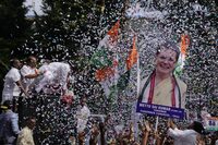 Supporters of India's main opposition party, Indian National Congress, display a cutout photo of their leader Sonia Gandhi, as they celebrate early leads for their party in Telangana state elections in Hyderabad, India, Sunday, Dec.3, 2023. Vote counting began in four Indian states in a test of strength for India's opposition pitted against the ruling party of Prime Minister Narendra Modi ahead of next year's crucial national vote. (AP Photo/Mahesh Kumar A)
