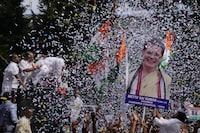 Supporters of India's main opposition party, Indian National Congress, display a cutout photo of their leader Sonia Gandhi, as they celebrate early leads for their party in Telangana state elections in Hyderabad, India, Sunday, Dec.3, 2023. Vote counting began in four Indian states in a test of strength for India's opposition pitted against the ruling party of Prime Minister Narendra Modi ahead of next year's crucial national vote. (AP Photo/Mahesh Kumar A)