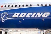 (FILES) In this file photo taken on June 18, 2017 the Boeing logo on the fuselage of a Boeing 787-10 Dreamliner test plane is seen on the Tarmac of Le Bourget on the eve of the opening of the International Paris Air Show. - Boeing reported better-than-expected fourth-quarter profits on January 30, 2019 and projected another strong year in 2019 on surging commercial plane deliveries. The aerospace giant, which has been boosted by a multi-year plane building boom amid surging global air travel demand, reported fourth-quarter profits of $3.4 billion, up 3.1 percent from the same period a year ago. (Photo by ERIC PIERMONT / AFP)ERIC PIERMONT/AFP/Getty Images