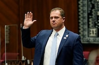 FILE - Arizona Rep. Jake Hoffman, R-Queen Creek, is sworn in during the opening of the Legislature at the state Capitol, Jan. 11, 2021, in Phoenix. Hoffman is one of 11 Republicans in Arizona who submitted a document to Congress falsely declaring Donald Trump had beaten Joe Biden in the state during the 2020 presidential election were charged Wednesday, April 24, 2024, with conspiracy, fraud and forgery, marking the fourth state to bring charges against "fake electors." (AP Photo/Ross D. Franklin, Pool, File)