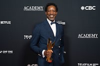 Arnold Pinnock clutches an award after "The Porter" wins the Award for Best Drama Series  at the Comedy and TV Drama awards evening at the Canadian Screen Awards, in Toronto, on Friday, April 14, 2023. THE CANADIAN PRESS/Chris Young 