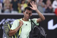 Felix Auger-Aliassime of Canada waves as he leave the court following his third round loss to Daniil Medvedev of Russia at the Australian Open tennis championships at Melbourne Park, Melbourne, Australia, Saturday, Jan. 20, 2024. (AP Photo/Asanka Brendon Ratnayake)