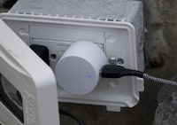 Electricity Canada is sounding an alarm over a proposed tax change it warns could see some private utilities saddled with millions in additional income taxes. A device is plugged into an electrical outlet, in St. John's, Saturday, June 24, 2023. THE CANADIAN PRESS/Adrian Wyld