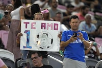 A fan holds up a sign for Inter Miami forward Lionel Messi in spanish that reads "I Love You," before the start of an MLS soccer match between Inter Miami and Toronto FC, Wednesday, Sept. 20, 2023, in Fort Lauderdale, Fla. (AP Photo/Wilfredo Lee)