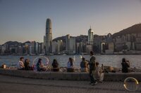 TOPSHOT - People visit a promenade next to Victoria Harbour in Hong Kong on January 18, 2024. (Photo by DALE DE LA REY / AFP) (Photo by DALE DE LA REY/AFP via Getty Images)