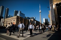 Toronto, Ontario - June 28, 2017 -- People walk during rush hour Bay Street in the financial district in Toronto, Wednesday June 28, 2017.   (Mark Blinch/Globe and Mail) 