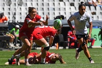 Canada's Chloe Daniels (L) passes the ball during the women's HSBC World Rugby Sevens Series 2023 quarter final match between New Zealand and Canada at the Cape Town stadium in Cape Town on December 10, 2023. (Photo by Rodger Bosch / AFP) (Photo by RODGER BOSCH/AFP via Getty Images)
