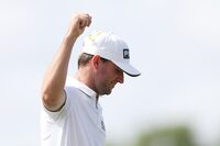 PALM BEACH GARDENS, FLORIDA - MARCH 04: Austin Eckroat of the United States celebrates on the 18th green on his way to winning during the continuation of the weather delayed final round of The Cognizant Classic in The Palm Beaches at PGA National Resort And Spa on March 04, 2024 in Palm Beach Gardens, Florida. (Photo by Brennan Asplen/Getty Images)