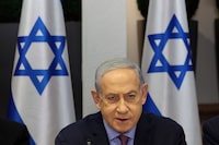 Israeli Prime Minister Benjamin Netanyahu attends the weekly cabinet meeting at the the Kirya military base in Tel Aviv, Israel Sunday, Dec. 31, 2023. (Abir Sultan/Pool Photo via AP)