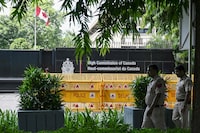 Security personnel stand guard in front of the High Commission of Canada in New Delhi on Sept. 19, 2023. Canada on September 18 accused India's government of involvement in the killing of a Canadian Sikh leader near Vancouver last June, prompting tit-for-tat diplomatic expulsions after New Delhi rejected the charge as "absurd." (Photo by ARUN SANKAR/AFP via Getty Images)
