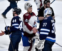 Colorado Avalanche goaltender Alexandar Georgiev (40) shakes hands with Winnipeg Jets goaltender Connor Hellebuyck (37) after Game 5 of their NHL hockey Stanley Cup first-round playoff series in Winnipeg, Tuesday April 30, 2024. THE CANADIAN PRESS/Fred Greenslade