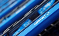 FILE PHOTO: Shopping carts are seen outside a new Walmart Express store in Chicago July 26, 2011. REUTERS/John Gress/File Photo