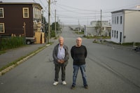 Walter Gillespie, left, and Robert Mailman pose in the south-end neighbourhood where they grew up in Saint John, N.B., Tuesday, Aug. 18, 2020. The prime minister says the federal government is going through "appropriate steps" in the case of two New Brunswick men who were acquitted by a judge of a 1983 murder for which they both served lengthy prison terms. THE CANADIAN PRESS/Darren Calabrese