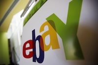 FILE - In this Feb. 24, 2010 file photo, an eBay logo is seen at their offices in San Jose, Calif. Online retailer eBay Inc. will cut about 1,000 jobs, or an estimated 9% of its full-time workforce, saying its number of employees and costs have exceeded how much the business is growing in a slowing economy. It marks the latest layoffs in the tech industry. (AP Photo/Paul Sakuma, File)